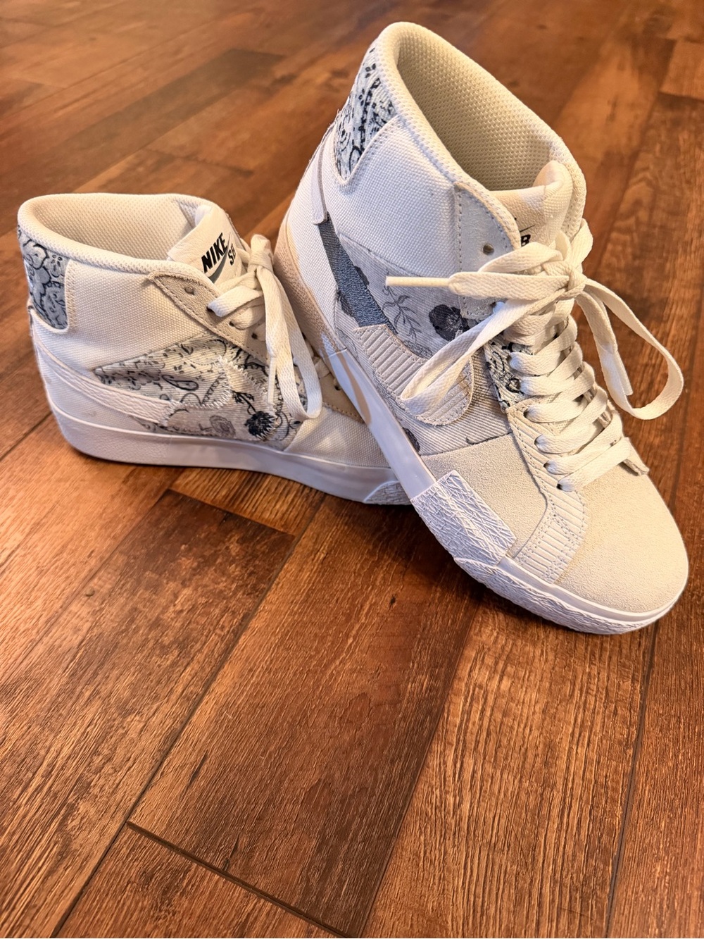 Nike Women’s High-Top Sneakers in White with Black Patterned Swoosh